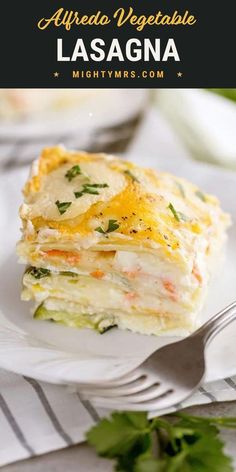 layered lasagna on a white plate with cilantro and parsley