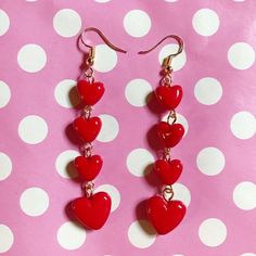 Pretty heart bead drop earringsRed bead heart dangling design Choice of gold plated fastenings Great statement earrings! Heart string measures 6cmFull drop depends on finish Dangle Clip-on Earrings For Valentine's Day Gift, Valentine's Day Gift Dangle Clip-on Earrings, Red Heart Beads Dangle Earrings, Red Dangle Heart Earrings, Heart Beads Drop Earrings For Valentine's Day, Valentine's Day Heart Bead Drop Earrings, Red Dangle Earrings With Heart Beads, Red Dangle Heart Earrings For Valentine's Day, Heart-shaped Dangle Earrings For Valentine's Day