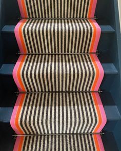 the stairs are painted with different colors and patterns