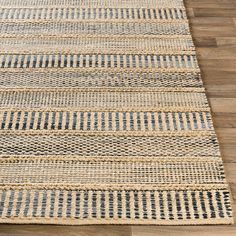 an area rug on the floor that has been made with braiding and jute