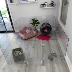 there are two chairs in the room, one is pink and the other is grey