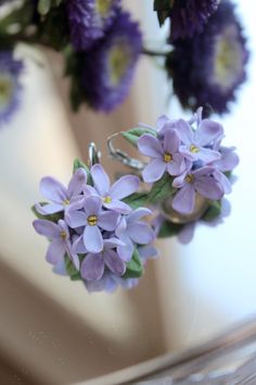 These exquisite handmade lavender flower earrings bring a touch of nature's elegance to your style. Delicately crafted from polymer clay, each earring showcases intricate details, capturing the beauty of fresh lavender blooms. These earrings are perfect for adding a soft, feminine touch to any outfit, whether you're dressing up for a special occasion or adding a hint of nature to your everyday look. Ideal for weddings, romantic dates, or as a thoughtful gift for someone special. Specifications: Material: Polymer clay Color: Lavender, green Size: Flower diameter 3 cm Closure Type: Leverback (French clip) Handmade: Yes Care instructions: 1. Use hardware to put on( don't push on petals on the edge). 2. Don't wet and try to avoid any water contact Gift Ideas: These earrings make a perfect gift Elegant Handmade Flower Earrings In Polymer Clay, Elegant Lavender Flower Earrings With Ear Wire, Elegant Earrings With 3d Flowers In Polymer Clay, Elegant Flower Shaped Polymer Clay Earrings, Elegant Handmade Flower Polymer Clay Earrings, Lavender Flower Earrings With Ear Wire, Elegant Handmade Lavender Flower Earrings, Elegant Polymer Clay Earrings With 3d Flowers, Lavender Flower Earrings