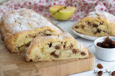 an apple pie is cut in half on a cutting board