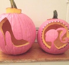 two pumpkins with high heel shoes on them