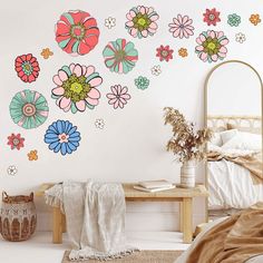 a bedroom with flowers painted on the wall