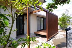 a small white house with a wooden porch