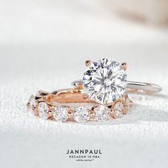 an engagement ring and wedding band are shown on a white surface with the words, janna paul