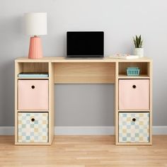 a desk with drawers and a laptop on it