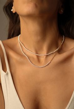 "Tiny Pearl Necklace Simple and feminine!  This timeless classic piece can perfectly be layered with other necklaces or pendants. A great gift for yourself or a loved one. Pearl necklace style: ♦️ natural freshwater pearl choker 16\"+2\" extender chain ♦️ half pearl necklace 16\"+2\" extender chain Details: * Pearl size: around 3mm  * Material: natural white freshwater pearls, 18k PVD gold-coated over stainless steel * Length:16\"+2\" chain extender  waterproof, hypoallergenic, nickel-free, grea Elegant Layered Pearl Necklace As Gift, Elegant Pearl Layered Necklace As Gift, Elegant Pearl Layered Necklace Gift, Minimalist White Double Chain Necklace, Elegant White Double Chain Necklace, Elegant White Necklace With Double Chain, Elegant Everyday Double Chain Necklace, Elegant White Layered Necklace With Adjustable Chain, White Double Chain Necklace Gift