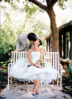 a bride and groom sitting on a bench with the caption don't complete with your husband learn to compliment him