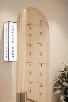 the lockers are lined up against the wall in the room with numbers on them