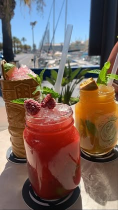 three different types of drinks on a table