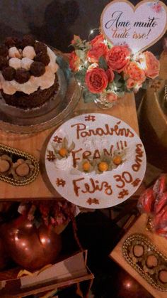 a table topped with lots of cakes and desserts