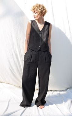 "We believe in handmade! Every piece is dedicated and made to the person who ordered it by using old traditional skills. About the linen vest: Vest made in a mid-weight pre-washed pure linen. Influenced by casual style but reimagined with a feminine touch. Create a classic feminine look by teaming it with black color linen palazzo trousers.  * Handmade in our studio * Regular fit * V-neckline * Single button closure * Buckle waist adjuster * Available from XXS to XXL size or can be made in a cus Linen Vest Oversize, Casual Washed Vest, Boho Fits, Gingham Fashion, Linen Vest, Peter Pan Collar Blouse, Gingham Linen, Vest Set, Palazzo Trousers