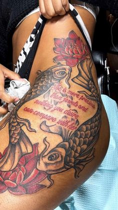 a woman with a tattoo on her thigh holding a bag in front of her stomach