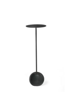 a black table with a round base on it