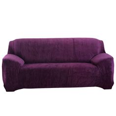 a purple couch sitting on top of a white floor