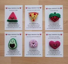 six crocheted valentine's day brooches are displayed on a table