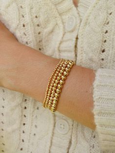 Gold Bead Bracelet, Beaded Bracelet, Gold Bracelet Stack, Stacking Bracelet 2mm 3mm 4mm, Dainty Bracelet Classic gold bead bracelet is a perfect addition to a dainty stack this spring/summer season. The beads are strung on a premium stretch cord. SOLD BY ONE BRACELET ITEMS DETAILS: Water Resistant -Nickel-free - Allergy-free - - High-Quality 18K gold plated brass beads made to last - round bead size: 2mm, 3mm, 4mm, 5mm -Freshwater pearls ( due they are natural pearls may vary the size and shape) Luxury Yellow Gold Jewelry With Tiny Beads, Gold Bracelet Beads, Beaded Gold Bracelet, Gold Bead Bracelet Stack, Pretty Stacks, Gold Beads Bracelet, Gold Bracelet Stack, Bead Bracelet Stack, Metal Bead Bracelet