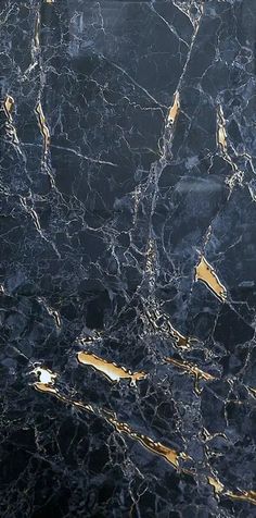 a black and gold marble textured wallpaper