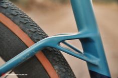 the front end of a bicycle with a blue frame