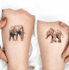 two elephants are shown on the legs of someone's thighs, one is black and white