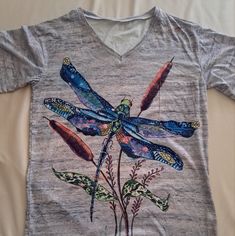 Brand New Has No Labels On The Inside Cute Dragonfly Top, Gray In Color Very Colorful Design On Front. V Neck Top This Is More Of A Petite Large, It's 19" Across Arm, 26" In Length. Very Cute Top. Does Have A Little Pocket On The Left Side Of The Upper Chest Area Thank You For Stopping By Our Closet. If You Love Dragonflies Get This One. I Do Not Know The Material Exactly It's More Of A Stretchy Material, But It's Not A Cotton T-Shirt It's More A Little Bit Of That. Dragonfly Shirt, Cute Dragonfly, V Neck Top, Cute Top, Colorful Design, Dragonflies, V Neck Tops, Cute Tops, Stretchy Material