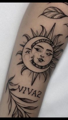 a sun and moon tattoo with the word viva on it's left arm, in front of a white background