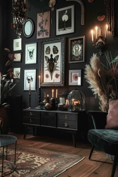 a living room filled with lots of pictures on the wall and candles in front of it