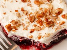 a close up of a dessert on a plate with a fork