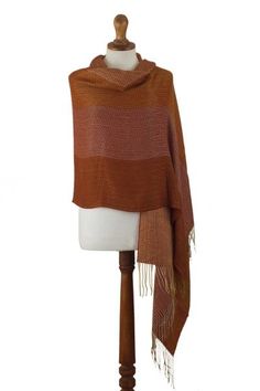 This vibrant wrap will work both as a shawl and a beautiful oversized scarf for cold winter days. Raquel and Gregor hand-weave it in a butter-soft baby alpaca blend and decorate it with a luxurious jacquard pattern in a warm combination of burnt orange amber and ochre tones. Raquel and Gregor aim to preserve their homeland's rich textile and weaving traditions through their work. One Size Pashmina Shawl For Fall, Alpaca Shawl For Fall, Bohemian Alpaca Shawl For Fall, Brown Alpaca Shawl For Fall, One Size Alpaca Shawl For Fall, Winter Pashmina Shawl One Size, Fall Pashmina Shawl, Traditional Woven Shawl For Fall, One Size Pashmina Shawl For Winter