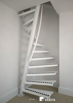 a white spiral staircase in an empty room