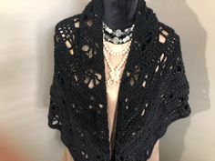 Black Butterfly Shawl This Crocheted Shawl was made from Silky Soft All Acrylic Yarn. The yarn has a delicate sheen and a wonderful drape. The lovely, darkest black color creates a classic, one of a kind finished product that will be enjoyed for years. This wonderful wrap can be worn any time of the year in place of a light weight jacket or sweater. It can be dressed up or down and is suitable for any formal occasion or as a change for everyday wear.  This piece will make a fine addition to your wardrobe or a well received gift for someone special. The dimensions are generous and this pretty Triangle Wrap can be worn several different ways. I tried to show a few options in the photos but I hope you experiment and have some fun on your own! This lovely Shawl will arrive nicely packaged with Black Crochet Shawls, Butterfly Shawl, Darkest Black, Crocheted Shawl, Darkest Black Color, Crochet Shawls, Triangle Scarf, Handmade Gifts For Her, Black Wrap