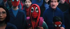 a group of people with spider - man masks in front of them, all staring at the same person