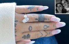 a woman's engagement ring with tattoos on her left hand and an image of the couple