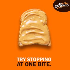 an orange advertisement with a piece of bread covered in peanut butter and the words try stopping at one bite