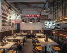 the inside of a restaurant with tables and chairs