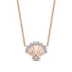 Expect smooth sailing in style with this sweet diamond seashell necklace from the Enchanted Disney Fine Jewelry Collection inspired by Ariel. Crafted in precious 10K rose gold, this blissful design showcases a grooved shell shimmering with diamonds along the scalloped border and fan-shaped pinnacle. Please feel free to purchase directly from this pin. Want more ideas or are searching for something specific? Email me at Gabrielle.Gruenloh@SignetJewelers.com! #ZalesEmployee Disney Inspired Jewelry, Ariel Necklace, Seashell Pendants, Scalloped Border, Smooth Sailing, Mermaid Jewelry