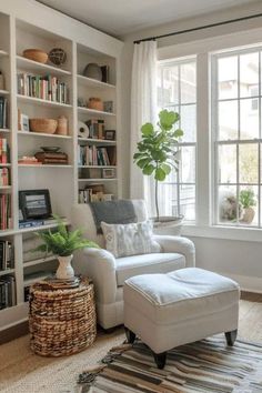 a living room filled with furniture and bookshelves next to a window covered in plants