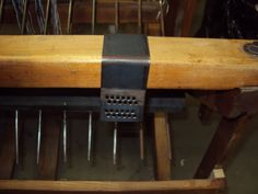 an old wooden table with metal grates on it