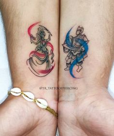 two people with matching tattoos on their legs, one is holding the other's hand