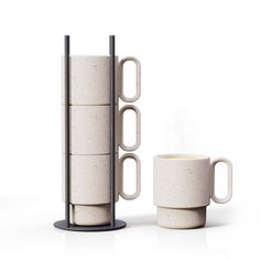 a stack of coffee mugs sitting next to each other