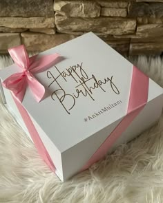 a birthday card in a gift box with a pink bow on it and the words happy birthday