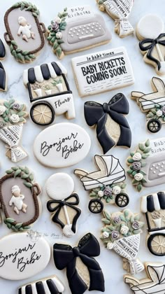 baby shower cookies are laid out on a table