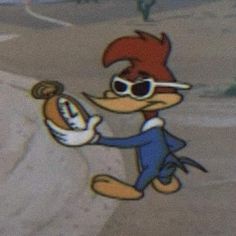 a cartoon character with sunglasses holding an object