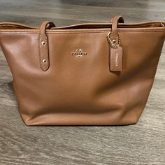 Excellent Condition Coach Handbag. I Only Used This Bag A Few Times. No Marks, Scratches Or Rips/Tears. Like Brand New. Any Questions Pls Let Me Know. Same Day Shipping If Ordered By 3pm! On-the-go Shoulder Bag With Branded Hardware, Daily Use Pouch Bags With Branded Hardware, Tan Tote Bag With Branded Hardware, Tan Bags With Branded Hardware For Everyday Use, Brown Pouch Bag With Branded Hardware, Brown Bag With Branded Hardware For Errands, Coach Everyday Tote Satchel, Satchel Bag With Branded Hardware For Everyday Use, Everyday Tote Satchel With Branded Hardware