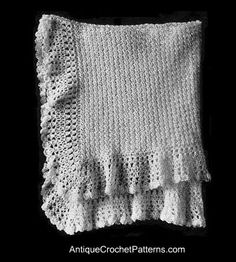 a white crocheted blanket with ruffled edges on a black background and the words antique crochet patterns written below it