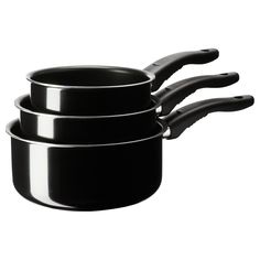 black pots and pans stacked on top of each other