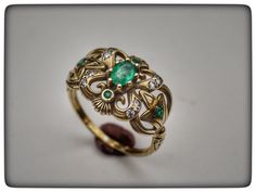 This stunning ring is my last and favorite design . 14k gold ring with emerald and diamonds . Central emerald stone weight : 0.6 carat . Diamond weight : 0.12 carat . Weight ring : 4.2 gram . Top ring length : 2 centimeter . Top ring width : 1.4 centimeter . Gold Emerald Ring With Diamond Accents, Gold Emerald Diamond Ring With Accents, Handmade Diamond Rings For Formal Occasions, Luxury Handmade Emerald Ring For Formal Occasions, Handmade Luxury Emerald Ring For Formal Occasions, Exquisite Emerald Jewelry With Accent Stones, Unique Oval Emerald Ring In Yellow Gold, Unique Yellow Gold Oval Emerald Ring, Handmade Elegant Diamond Ring