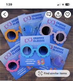 five children's glasses are sitting on top of each other